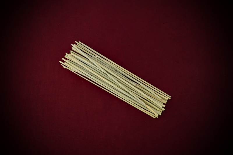 Dried Botanicals Wheatgrass Bare Stems—20 to 23cm lengths—displayed on a rich blood-red background by Gypsy Red Corpse.