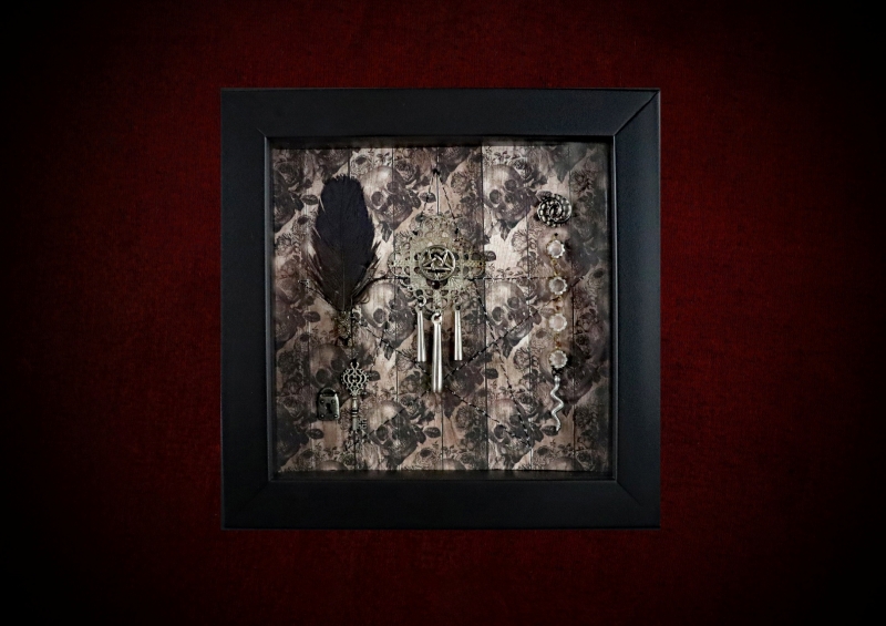 Handmade black Wiccan shadow box frame containing a sepia skulls and roses backdrop with a machine-sewn pentagram and traditional occult curiosities.