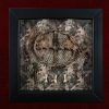 Detailed shot of a handcrafted willow branch sun wheel harvested during a summer solstice on a snake skin backdrop inside a pagan curio frame.