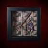 Repurposed black shadow box frame featuring a handmade willow witch besom and an amethyst tree of life on a witch's boots backdrop.