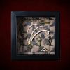 Repurposed black shadow box frame featuring hare rib bones, a hare's head key, and an motivational folklore plaque on a witch's boots backdrop.