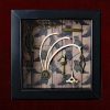 Detailed shot of three hare rib bones arching over an ornate hare-headed key with an authentic hare vertebra in an occult curio frame.