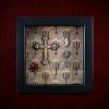 Repurposed black shadow box frame featuring a large diamante cross, Virgin Mary reliquary, and a pentagram charm on a candelabra backdrop.