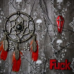 Detailed close-up focusing on the vibrant red enamel coffin charm with an inset cross and the bold red painted word ‘FUCK’ beneath it.