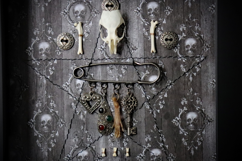 Detailed close-up of the chatelaine assembly showing the intricate textures of the silver marcasite pendant, the real preserved rat paw, the filigree heart, and the vintage-style metal key.